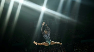Biles dazzles in Paris Olympics debut despite injury scare