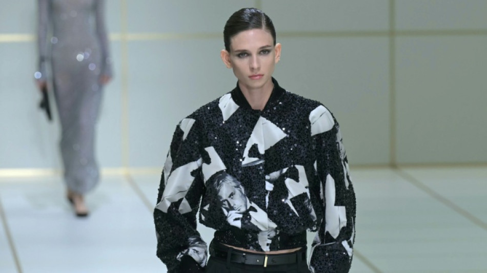 Armani sprinkles glitter on discreet elegance at Milan show