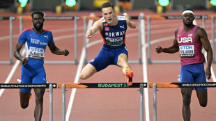 Warholm 'turns on turbos' to win third world 400m hurdles title