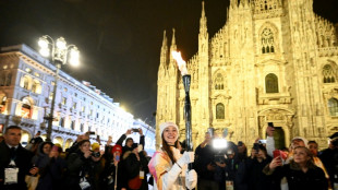 Flame arrives in Milan for Winter Olympics ceremony