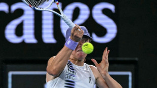 Swiatek survives roller coaster to reach Australian Open last 16