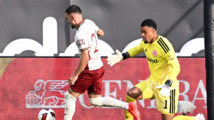 Minnows Augsburg sink Frankfurt to top Bundesliga table